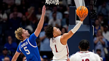 Alabama guard Mark Sears (1) shoots past Kentucky guard Collin Chandler (5) during the first half of a Southeastern Conference tournament quarterfinal game at Bridgestone Arena in Nashville, Tenn., Friday, March 14, 2025.