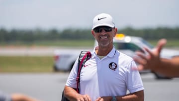 Florida State baseball coach Link Jarrett boards a plane with his team as they leave to play in the College World Series in Omaha, Nebraska, Wednesday, June 12, 2024.