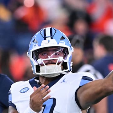 Oct 31, 2025; Syracuse, New York, USA; North Carolina Tar Heels quarterback Gio Lopez (7) warms up before a game against the Syracuse Orange at the JMA Wireless Dome. 