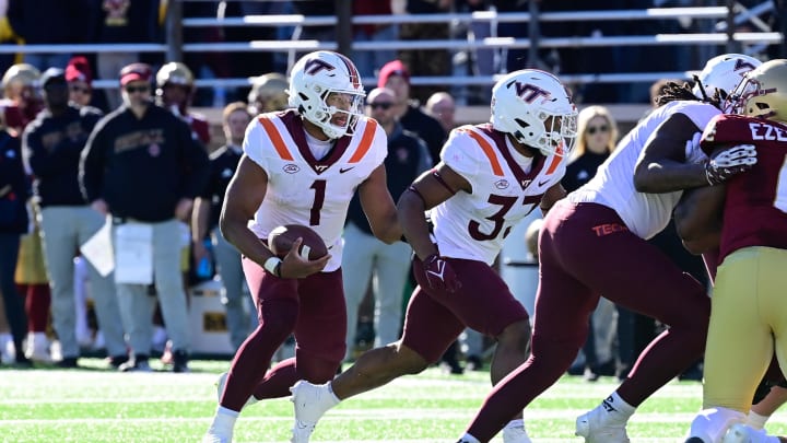 Nov 11, 2023; Chestnut Hill, Massachusetts, USA; Virginia Tech Hokies quarterback Kyron Drones (1) runs the ball  during the first half against the Boston College Eagles at Alumni Stadium. Mandatory Credit: Eric Canha-USA TODAY Sports