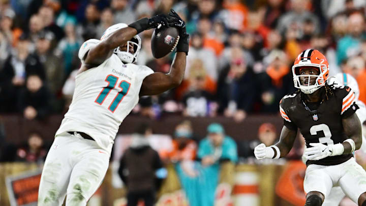 Dec 29, 2024; Cleveland, Ohio, USA; Cleveland Browns wide receiver Jerry Jeudy (3) watches as Miami Dolphins linebacker Tyrel Dodson (11) intercepts the pass during the first half at Huntington Bank Field.