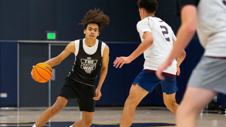 South Bend Washington's Steven Reynolds, left, dribbles the ball up the court during a scrimmage at the Notre Dame Team Camp at Rolfs Athletics Hall on Thursday, June 13, 2024, in South Bend.