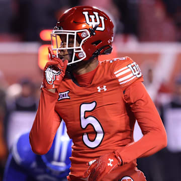 Nov 9, 2024; Salt Lake City, Utah, USA; Utah Utes cornerback Zemaiah Vaughn (5) reacts after a sack against the Brigham Young Cougars during the second half at Rice-Eccles Stadium.