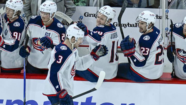 Blue Jackets center Charlie Coyle celebrates a goal with his bench.