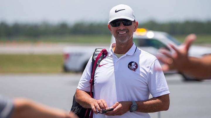 Florida State baseball coach Link Jarrett boards a plane with his team as they leave to play in the College World Series in Omaha, Nebraska, Wednesday, June 12, 2024.