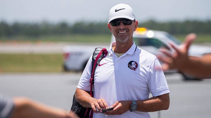 Florida State baseball coach Link Jarrett boards a plane with his team as they leave to play in the College World Series in Omaha, Nebraska, Wednesday, June 12, 2024.
