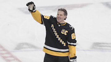 Feb 18, 2024; Pittsburgh, Pennsylvania, USA;  Pittsburgh Penguins former right wing Jaromir Jagr (68) waves to the crowd at the conclusion of warm-ups against the Los Angeles Kings at PPG Paints Arena. Mandatory Credit: Charles LeClaire-Imagn Images