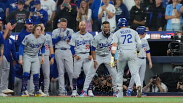 Nov 1, 2025; Toronto, Ontario, CAN; Los Angeles Dodgers second baseman Miguel Rojas (72) reacts after hitting a home run against the Toronto Blue Jays in the ninth inning for game seven of the 2025 MLB World Series at Rogers Centre. Mandatory Credit: Nick Turchiaro-Imagn Images