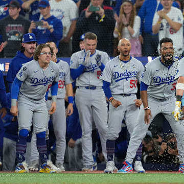 Nov 1, 2025; Toronto, Ontario, CAN; Los Angeles Dodgers second baseman Miguel Rojas (72) reacts after hitting a home run against the Toronto Blue Jays in the ninth inning for game seven of the 2025 MLB World Series at Rogers Centre. Mandatory Credit: Nick Turchiaro-Imagn Images