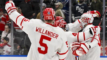 Apr 10, 2025; St. Louis, Missouri: Boston University celebrates after the Terriers defeated the Penn State Nittany Lions to advance to the 2025 national championship game.
