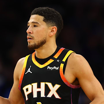 Apr 9, 2025; Phoenix, Arizona, USA; Phoenix Suns guard Devin Booker (1) reacts after a play against the Oklahoma City Thunder during the first half at Footprint Center. Mandatory Credit: Mark J. Rebilas-Imagn Images
