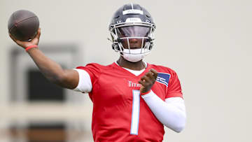 May 10, 2025; Nashville, TN, USA;  Tennessee Titans quarterback Cam Ward (1) throws during drills during Rookie Mini Camp at Saint Thomas Sports Park. Mandatory Credit: Steve Roberts-Imagn Images