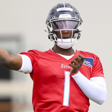 May 10, 2025; Nashville, TN, USA;  Tennessee Titans quarterback Cam Ward (1) throws during drills during Rookie Mini Camp at Saint Thomas Sports Park. Mandatory Credit: Steve Roberts-Imagn Images
