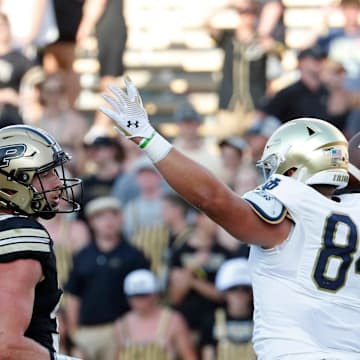 Notre Dame Fighting Irish tight end Cooper Flanagan (87) and Notre Dame Fighting Irish tight end Kevin Bauman (84) celebrates in front of Purdue Boilermakers defensive back Dillon Thieneman (31) after a Notre Dame Fighting Irish touchdown Saturday, Sept. 14, 2024, during the NCAA football game at Ross-Ade Stadium in West Lafayette, Ind. Notre Dame Fighting Irish won 66-7.