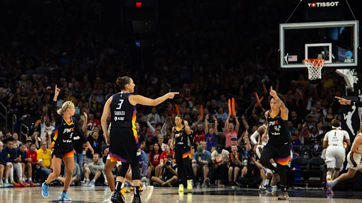 Jun 30, 2024; Phoenix, Arizona, USA; Phoenix Mercury guard Diana Taurasi (3) celebrates with center Brittney Griner (42), guard Sophie Cunningham (9) and guard Sug Sutton (1) against the Indiana Fever at Footprint Center. Mandatory Credit: Mark J. Rebilas-Imagn Images