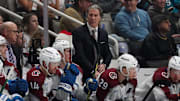 Dec 19, 2024; San Jose, California, USA;  Colorado Avalanche head coach Jared Bednar watches the action from the bench during a game against the San Jose Sharks in the first period at SAP Center at San Jose. Mandatory Credit: David Gonzales-Imagn Images