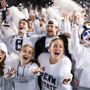 Penn State students sing along to a song during the 2023 White Out football game against Iowa at Beaver Stadium. 