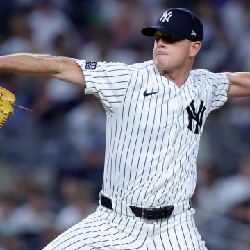 Jun 9, 2024; Bronx, New York, USA; New York Yankees relief pitcher Caleb Ferguson (64) pitches against the Los Angeles Dodgers during the sixth inning at Yankee Stadium.