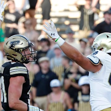 Notre Dame Fighting Irish tight end Cooper Flanagan (87) and Notre Dame Fighting Irish tight end Kevin Bauman (84) celebrates in front of Purdue Boilermakers defensive back Dillon Thieneman (31) after a Notre Dame Fighting Irish touchdown Saturday, Sept. 14, 2024, during the NCAA football game at Ross-Ade Stadium in West Lafayette, Ind. Notre Dame Fighting Irish won 66-7.