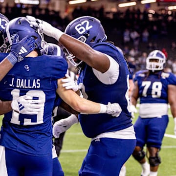Dec 19, 2024; New Orleans, LA, USA;  Georgia Southern Eagles wide receiver Josh Dallas (19) reacts to scoring a touchdown against Sam Houston State Bearkats linebacker Sincere Jackson (8) during the first half at Caesars Superdome. Mandatory Credit: Stephen Lew-Imagn Images