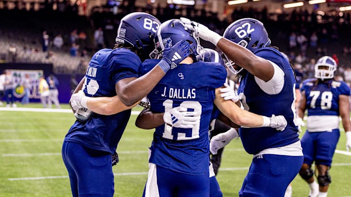 Dec 19, 2024; New Orleans, LA, USA; Georgia Southern Eagles wide receiver Josh Dallas (19) reacts to scoring a touchdown against Sam Houston State Bearkats linebacker Sincere Jackson (8) during the first half at Caesars Superdome. Mandatory Credit: Stephen Lew-Imagn Images Dec 19, 2024; New Orleans, LA, USA; Georgia Southern Eagles wide receiver Josh Dallas (19) reacts to scoring a touchdown against Sam Houston State Bearkats linebacker Sincere Jackson (8) during the first half at Caesars Superdome. Mandatory Credit: Stephen Lew-Imagn Images
