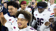 Nov 28, 2025; Tempe, Arizona, USA; Arizona Wildcats defensive back Dalton Johnson (43) celebrates with the Territorial Cup trophy after defeating the Arizona State Sun Devils in the 99th Territorial Cup at Mountain America Stadium. Mandatory Credit: Mark J. Rebilas-Imagn Images