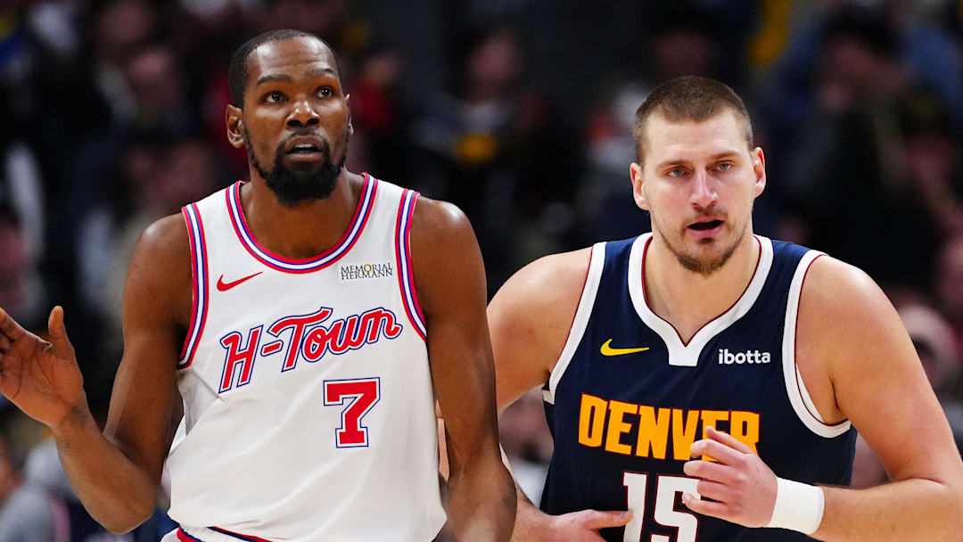 Dec 15, 2025; Denver, Colorado, USA; Houston Rockets forward Kevin Durant (7) and Denver Nuggets center Nikola Jokic (15) during the second quarter at Ball Arena.