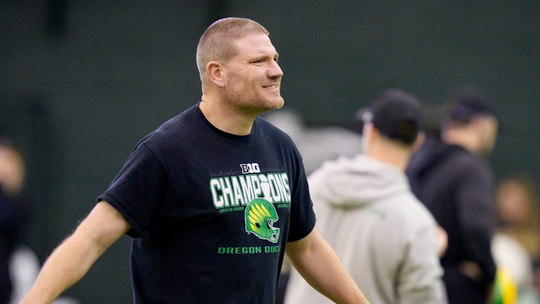 Oregon defensive coordinator Tosh Lupoi walks the field during an open practice ahead of the Orange Bowl at the Moshofsky Center in Eugene, Oregon on Dec. 27, 2025.