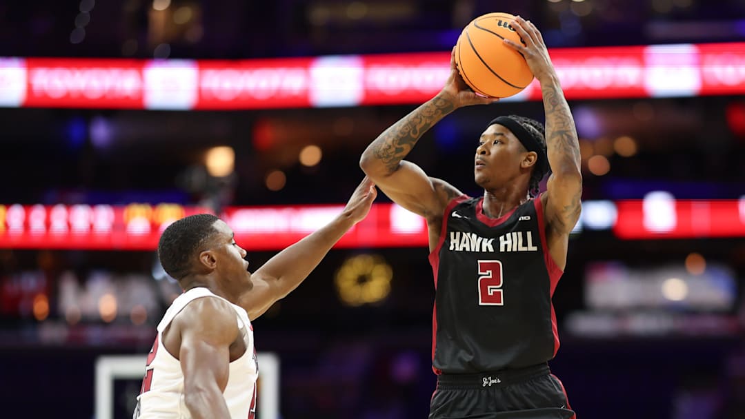 Dec 6, 2025; Philadelphia, PA, USA; Saint Joseph's Hawks guard Deuce Jones II (2) shoots against Temple Owls guard Derrian Ford (22) during the first half at Xfinity Mobile Arena. Mandatory Credit: Bill Streicher-Imagn Images Dec 6, 2025; Philadelphia, PA, USA; Saint Joseph's Hawks guard Deuce Jones II (2) shoots against Temple Owls guard Derrian Ford (22) during the first half at Xfinity Mobile Arena. Mandatory Credit: Bill Streicher-Imagn Images