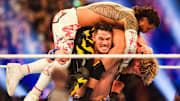 John Cena lifts Jey Uso and Logan Paul on his shoulders Saturday, Feb. 1, 2025, during the WWE Royal Rumble at Lucas Oil Stadium in Indianapolis.