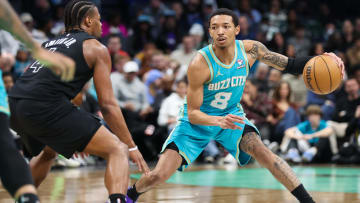 Mar 9, 2024; Charlotte, North Carolina, USA;  Charlotte Hornets guard Nick Smith Jr. (8) drives the play against Brooklyn Nets guard Dennis Smith Jr. (4) during the third quarter at Spectrum Center. Mandatory Credit: Cory Knowlton-USA TODAY Sports