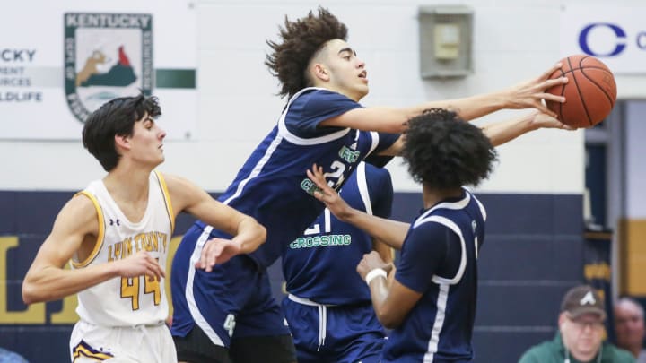 Great Crossing's Malachi Moreno grabs a rebound against Lyon County in the first half Monday's King of the Bluegrass in Fairdale. Dec. 19, 2022

King Of The Bluegrass Monday 2022