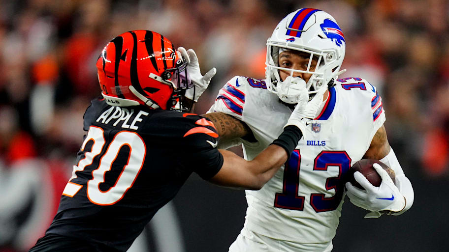 Buffalo Bills wide receiver Gabe Davis (13) stiff arms Cincinnati Bengals cornerback Eli Apple (20) on a catch in the first quarter of the NFL Week 17 game between the Cincinnati Bengals and the Buffalo Bills at Paycor Stadium in Downtown Cincinnati on Monday, Jan. 2, 2023. The game was suspended with suspended in the first quarter after Buffalo Bills safety Damar Hamlin (3) was taken away in an ambulance following a play.

Buffalo Bills At Cincinnati Bengals Week 17 | Sam Greene / USA TODAY NETWORK