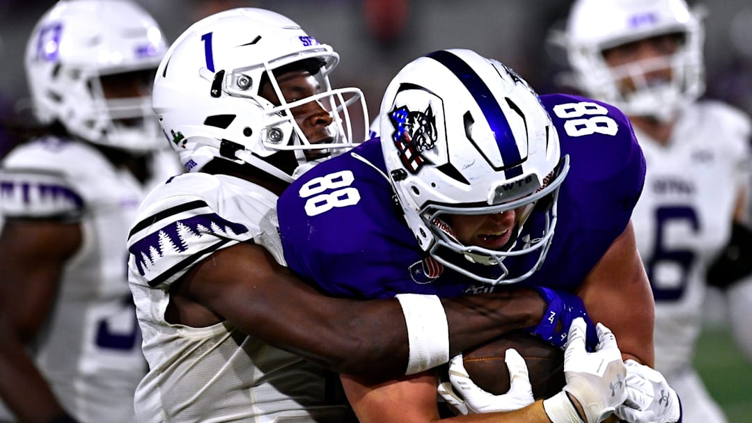 SFA cornerback Charles Demmings and ACU tight end Jed Castles. SFA cornerback Charles Demmings and ACU tight end Jed Castles.