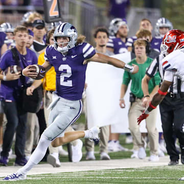 Sep 13, 2024; Manhattan, Kansas, USA; Kansas State Wildcats quarterback Avery Johnson (2) is forced out of bounds by Arizona Wildcats defensive back Tacario Davis (1) during the third quarter at Bill Snyder Family Football Stadium.