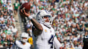 Dallas Cowboys quarterback Dak Prescott (4) looks to pass downfield as New York Jets defensive tackle Quinnen Williams (95) defends during the first half at MetLife Stadium.