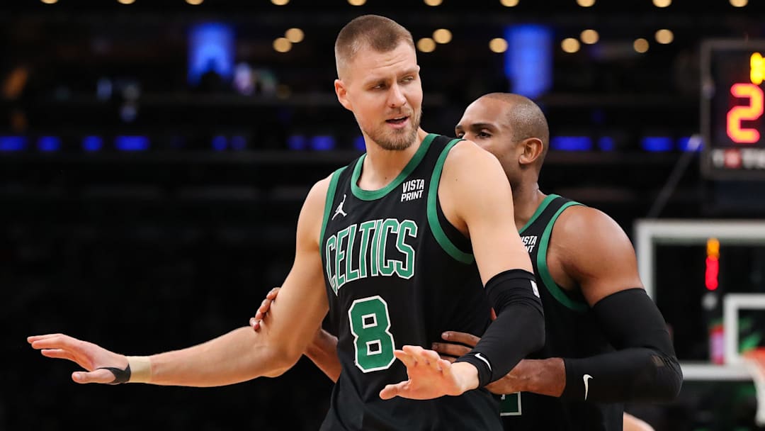 Nov 22, 2023; Boston, Massachusetts, USA; Boston Celtics center Kristaps Porzingis (8) reacts after getting a technical foul during the second half against the Milwaukee Bucks at TD Garden. Mandatory Credit: Paul Rutherford-Imagn Images