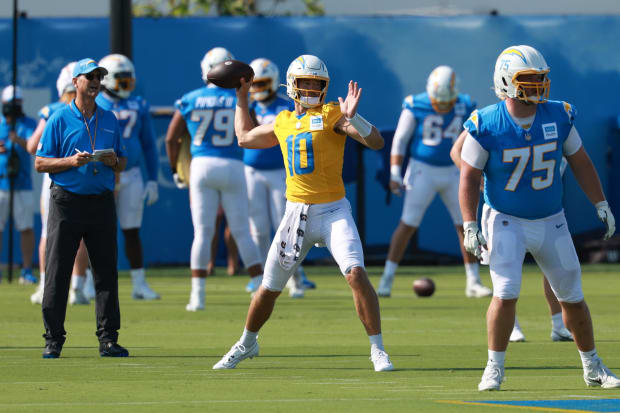 Justin Herbert throws a pass at a Chargers practice.