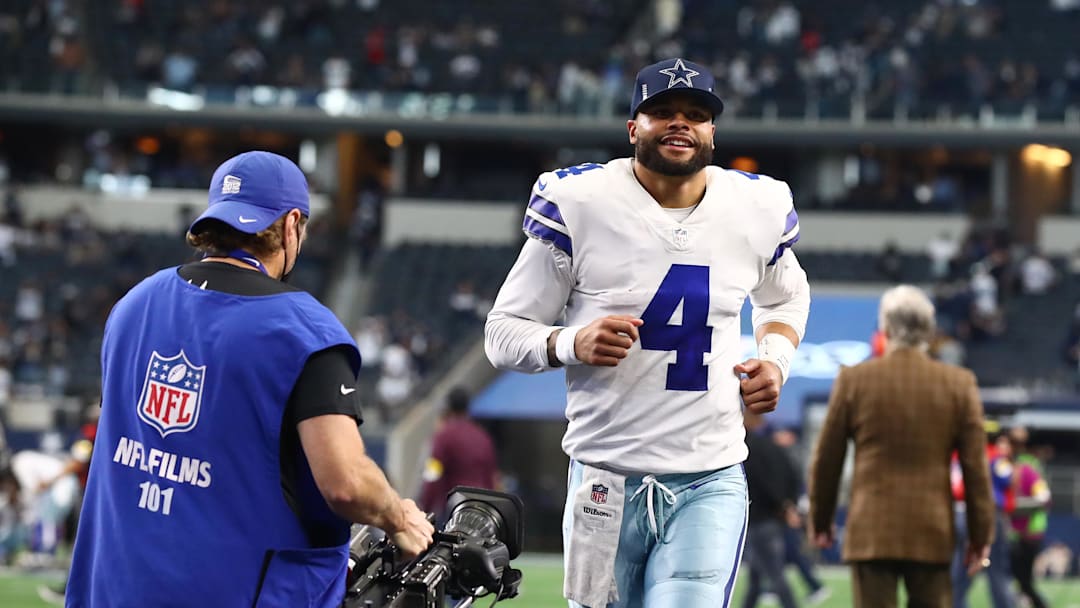 Nov 14, 2021; Arlington, Texas, USA; Dallas Cowboys quarterback Dak Prescott (4) smiles as he leaves the field after a victory against the Atlanta Falcons at AT&T Stadium. Mandatory Credit: Matthew Emmons-Imagn Images