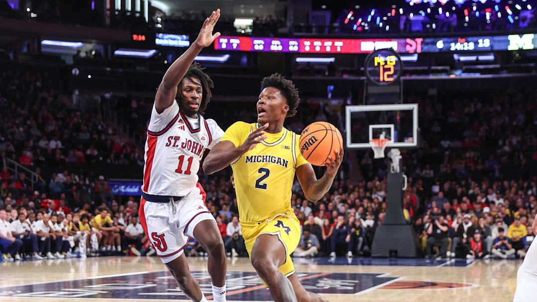 Oct 25, 2025; New York, NY, USA;  Michigan Wolverines guard L.J.C.ason (2) looks to drive past St. John's Red Storm guard Ian Jackson (11) in the first half at Madison Square Garden. 
