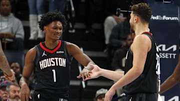 Nov 5, 2025; Memphis, Tennessee, USA; Houston Rockets guard Amen Thompson (1) reacts with center Alperen Sengun (28) during the first quarter against the Memphis Grizzlies at FedExForum. Mandatory Credit: Petre Thomas-Imagn Images