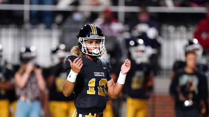 Oct 20, 2023; Carrollton, GA, USA; Carrollton Trojans quarterback Julian Lewis (10) reacts to a pass against the Westlake Lions during the first half at Grisham Stadium. The 15-year-old Carrollton High student has already committed to playing for the University of Southern California Trojans and has been considered one of the top high school quarterback prospects. Mandatory Credit: John David Mercer-USA TODAY Sports