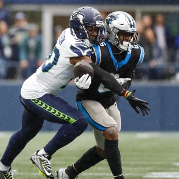 Sep 24, 2023; Seattle, Washington, USA; Seattle Seahawks cornerback Michael Jackson (30) breaks a up a pass intended for Carolina Panthers running back Miles Sanders (6) during the fourth quarter at Lumen Field. Mandatory Credit: Joe Nicholson-USA TODAY Sports