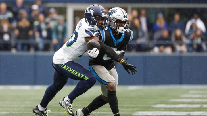 Sep 24, 2023; Seattle, Washington, USA; Seattle Seahawks cornerback Michael Jackson (30) breaks a up a pass intended for Carolina Panthers running back Miles Sanders (6) during the fourth quarter at Lumen Field. Mandatory Credit: Joe Nicholson-USA TODAY Sports