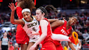 May 17, 2025; Indianapolis, Indiana, USA; Indiana Fever guard Caitlin Clark (22) steals the ball from Chicago Sky forward Angel Reese (5) in the second half at Gainbridge Fieldhouse. Mandatory Credit: Trevor Ruszkowski-Imagn Images