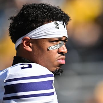 Oct 26, 2024; Iowa City, Iowa, USA; Northwestern Wildcats quarterback Mike Wright (5) looks on before a game against the Iowa Hawkeyes at Kinnick Stadium. Mandatory Credit: Jeffrey Becker-Imagn Images