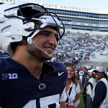 Penn State Nittany Lions quarterbacks Ethan Grunkemeyer (17) and Drew Allar (15) share a moment together following the game against the Nevada Wolf Pack at Beaver Stadium.