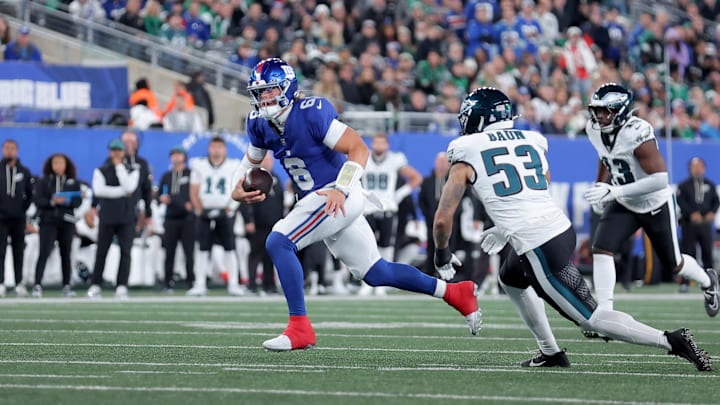 Oct 9, 2025; East Rutherford, New Jersey, USA; New York Giants quarterback Jaxson Dart (6) runs with the ball for a touchdown against Philadelphia Eagles linebackers Zack Baun (53) and Azeez Ojulari (13) during the first quarter at MetLife Stadium. Mandatory Credit: Brad Penner-Imagn Images Oct 9, 2025; East Rutherford, New Jersey, USA; New York Giants quarterback Jaxson Dart (6) runs with the ball for a touchdown against Philadelphia Eagles linebackers Zack Baun (53) and Azeez Ojulari (13) during the first quarter at MetLife Stadium. Mandatory Credit: Brad Penner-Imagn Images
