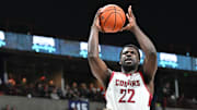 Nov 21, 2024; Spokane, Washington, USA; Washington State Cougars forward ND Okafor (22) is called for a charge on his drive against Eastern Washington Eagles guard Andrew Cook (9) in the second half at Spokane Veterans Memorial Arena. Washington State Cougars won 96-81. Mandatory Credit: James Snook-Imagn Images