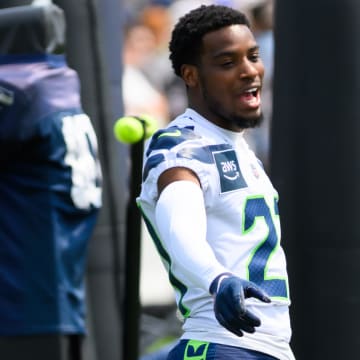 Jul 27, 2024; Renton, WA, USA; Seattle Seahawks cornerback Devon Witherspoon (21) points at safety Rayshawn Jenkins (2) during training camp at Virginia Mason Athletic Center. Mandatory Credit: Steven Bisig-USA TODAY Sports